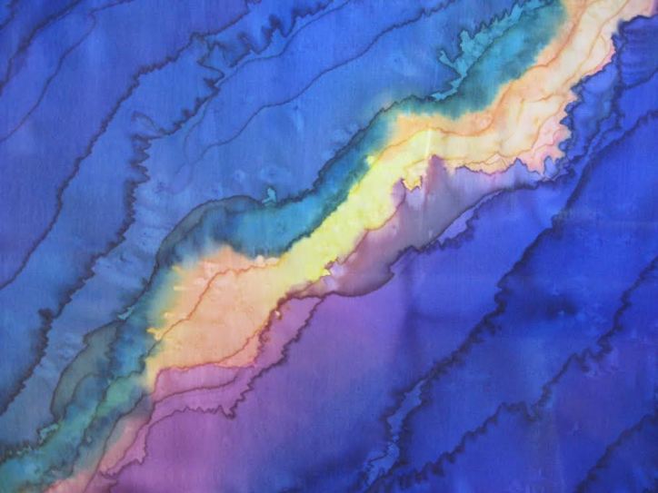 silk paintingof layers of dark blue with yellow, gold, and orange light cracking through.